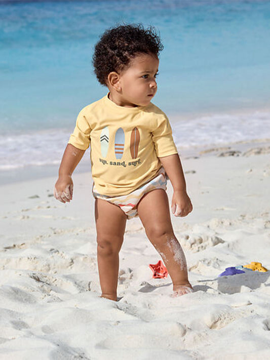 CAMISETA PROTECCIÓN SOLAR SURFBOARDS VANILLA Lassig KIDSME