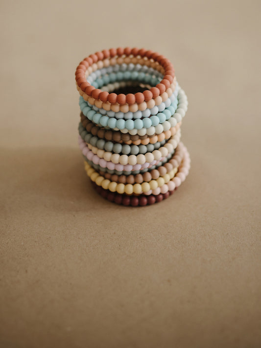 3 PULSERAS MORDEDOR PEARL MELLOW/TERRACOTA/PERIWINKLE Mushie KIDSME